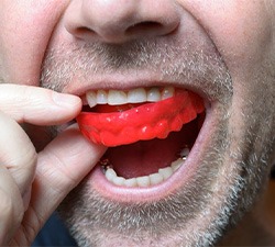 Man wears mouthguard