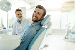 a patient smiling after undergoing a dental checkup